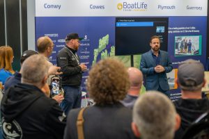 A crowd gathered round an exhibition stand at the NEC in Birmingham watching Adam Jones and Richard Dove at the launch announcement of The BoatLife fishing competition.