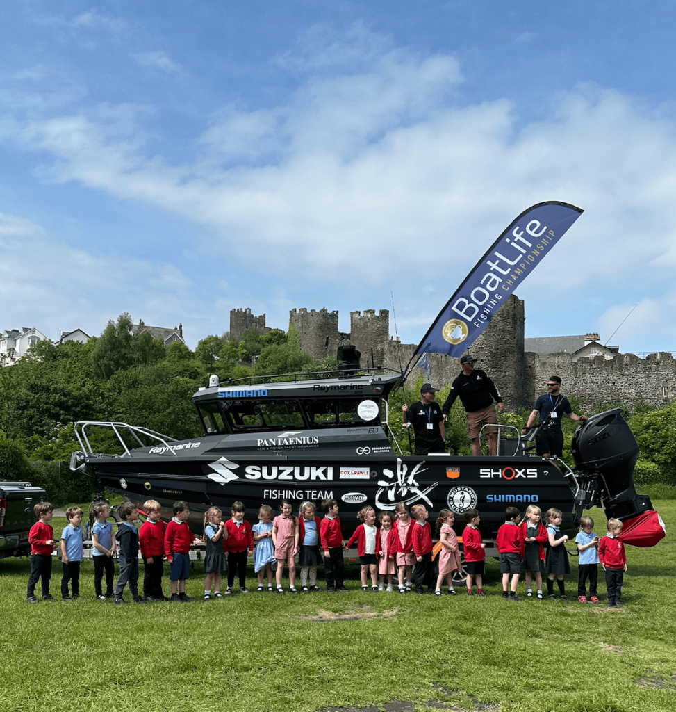 School pupils viewing boats